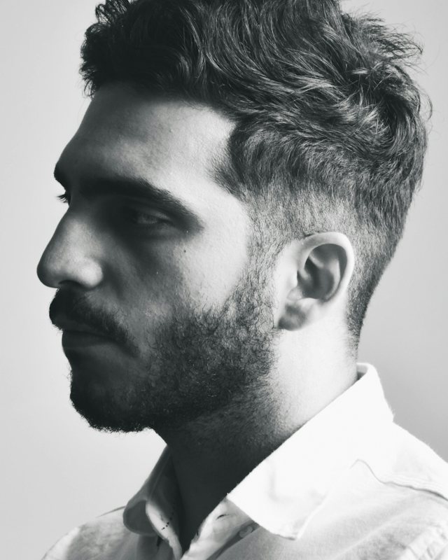 Homem com degradê e barba desenhada